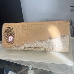 Elegant Tan Clutch with Pink Gemstone Accent